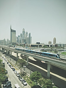 blue and black train on railway thumbnail