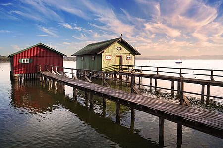 two brown wooden dock under white clouds at daytime thumbnail