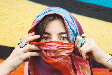 woman wearing veil near multicolored concrete wall thumbnail