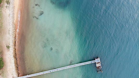 aerial photography of dock on water during daytime thumbnail