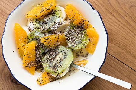 vegetable salad on plate with spoon placed on table thumbnail