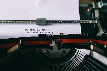 Closeup view of typing quotes on the old typewriter thumbnail