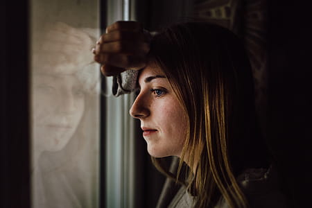 Woman Leaning on Glass Window thumbnail
