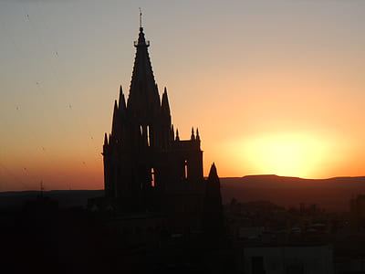 silhouette of castle during golden hour thumbnail