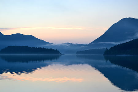 body of water between islands during daytime thumbnail