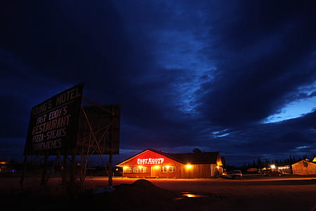 brown and black house under clear blue sky during nighttime thumbnail