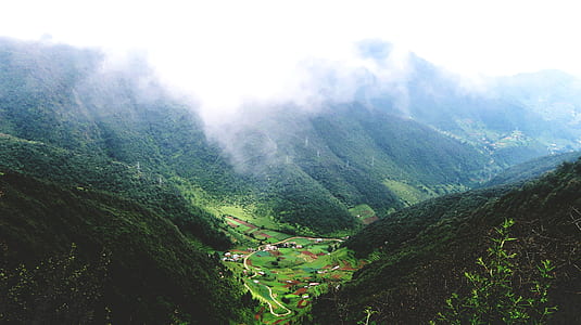 white clouds above green mountain thumbnail