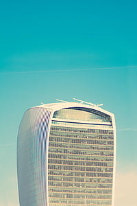 high-rise building with contrail thumbnail