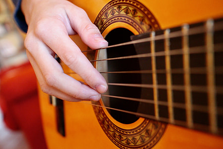 person plays acoustic guitar thumbnail