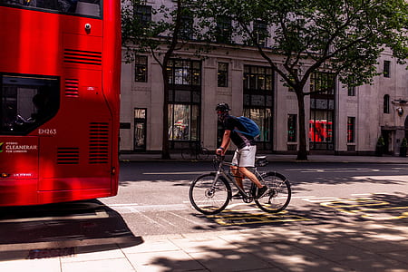 man rides gray bike thumbnail