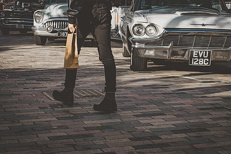 person wearing black pants and black shoes thumbnail