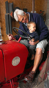 man sitting on tractor with boy thumbnail
