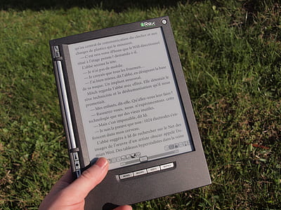 person holding turned-on e-book reader thumbnail