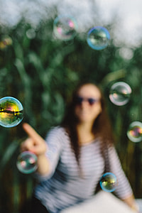 Having fun with soap bubbles in the nature thumbnail