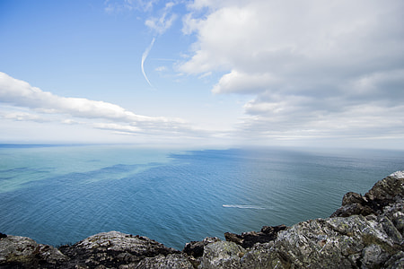 calm blue sea under cloudy sky thumbnail