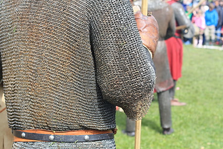 person in warrior suit standing on grass field thumbnail
