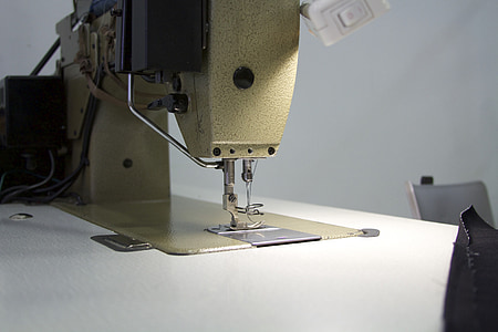 sewing machine beside painted wall thumbnail