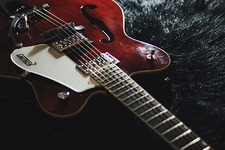 focus photograph of black electric guitar thumbnail