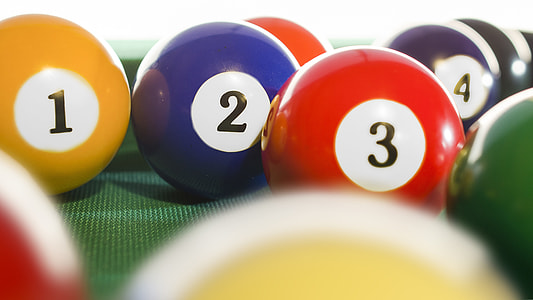 set of cue balls on pool table thumbnail