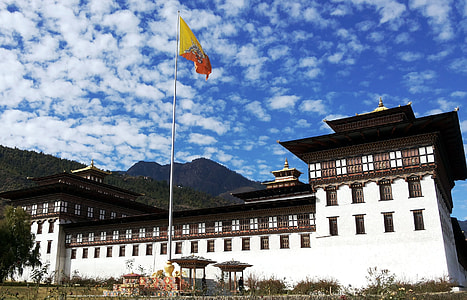 orange and yellow flag hanged in pole thumbnail