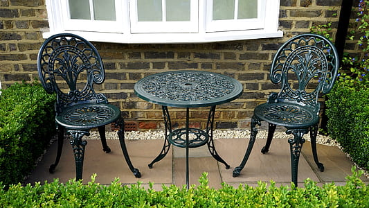 three-piece black metal patio table and chair set thumbnail
