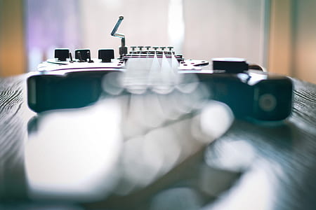 selective focus photo of black guitar thumbnail
