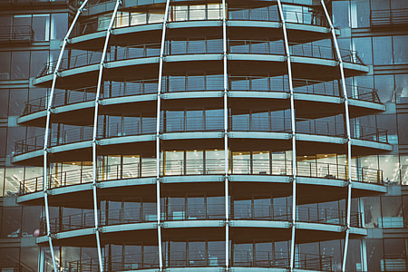 Wide-angle shot of glass windows on a building on The Thames river in London, England thumbnail