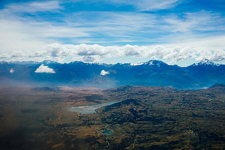 mountains under white clouds at daytime thumbnail