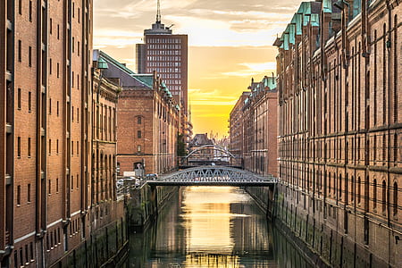 canal between brown concrete building thumbnail