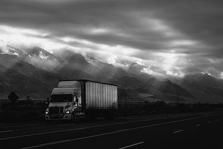 box truck on road during nighttime thumbnail