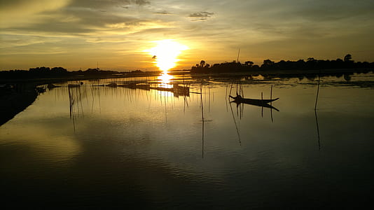 boat on calm body of water thumbnail