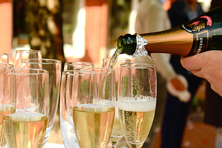 person pouring champagne in glasses thumbnail