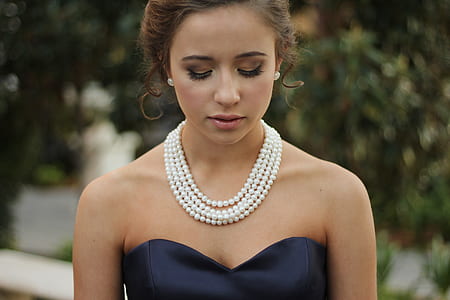woman wearing black sweetheart dress thumbnail