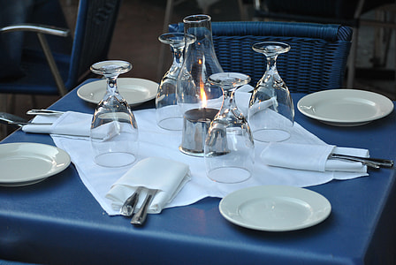 white ceramic plate with wine glass on blue square top table thumbnail