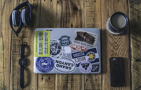 watch, headset, teacup, and iPhone on top of table thumbnail