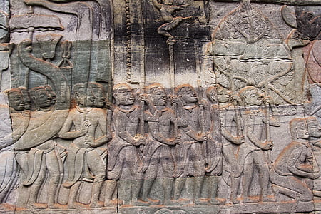 gray and brown embossed wall decor at daytime thumbnail