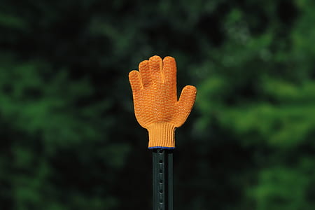 black metal stick with orange glove thumbnail
