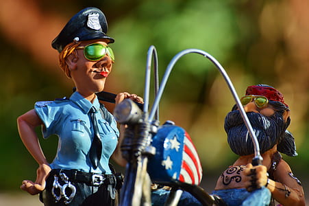 police woman and man riding on motorcycle figures thumbnail
