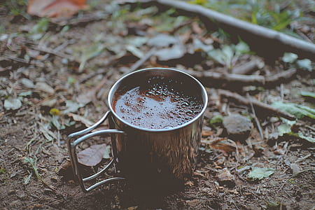 filled brown mug on brown soil thumbnail