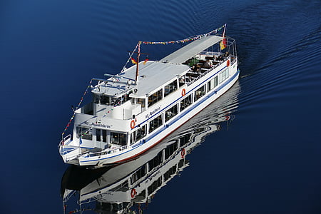 white cruise ship on large body of water during daytime thumbnail