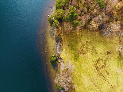 bird's eye view photo of body of water and island thumbnail