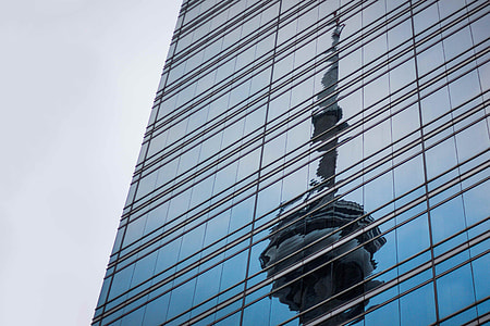 Statue of Liberty reflected on glass of building thumbnail