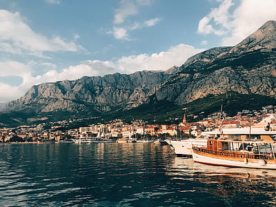 boats docked near island thumbnail