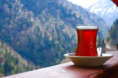 clear Turkish tea glass on brown board thumbnail