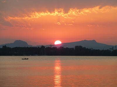silhouette of boat during golden hour thumbnail