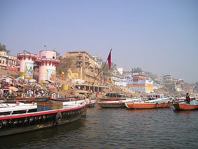 boat on body of water beside house thumbnail