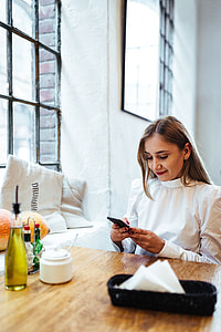 Pretty blonde woman sitting in the cafe thumbnail