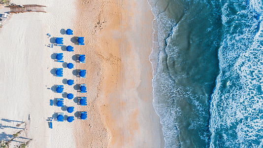 bird's-eye view photography of white sand beach thumbnail