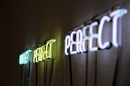 three lighted neon signage mounted on wall thumbnail