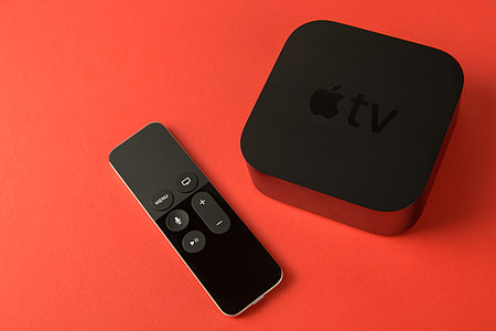 Overhead shot of the 4th generation Apple TV media player and touch remote control thumbnail
